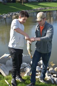 two boys and a bass