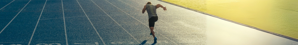 single runner on track at dawn